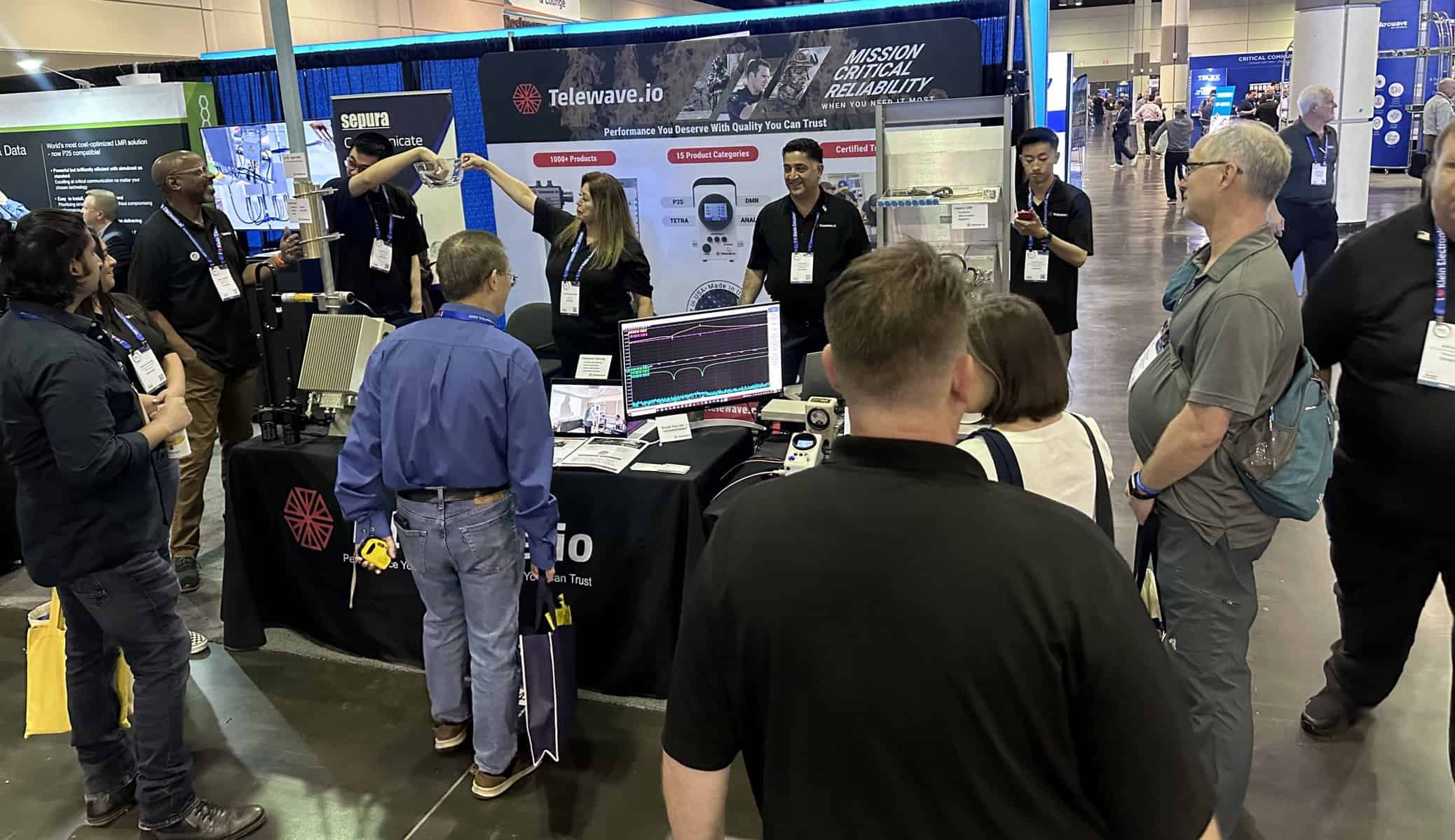Visitors at the Telewave booth